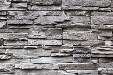 Textura šedé kamenné zdi
